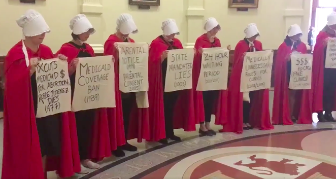 Women dressed like characters from The Handmaid's Tale protesting anti-abortion bills at the Texas state capitol during the 2019 legislative session. - TWITER / ALEXA GARCIA-DITTA