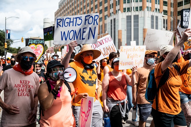 San Antonio protesters take to the streets during a recent march against Texas' abortion ban. - JAIME MONZON