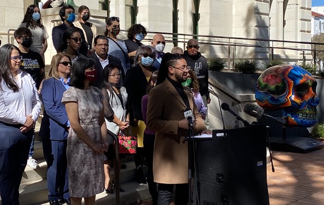 Jalen McKee-Rodriguez speaks in front of City Hall about a proposed expansion of San Antonio's non-discrimination ordinance. - SANFORD NOWLIN