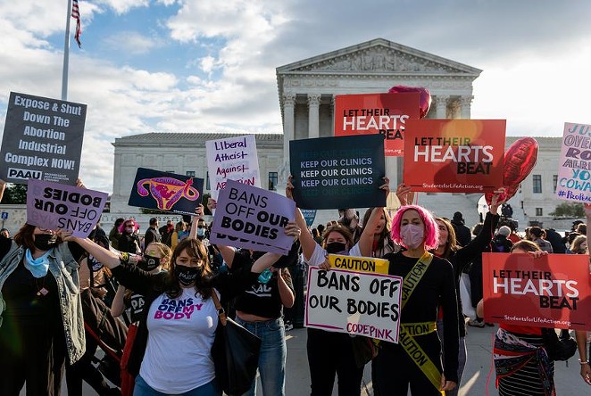 Abortion opponents clashed with abortion rights activists outside the U.S. Supreme Court on Monday while justices heard cases regarding Texas’ near-total abortion ban. - TEXAS TRIBUNE / ERIC LEE