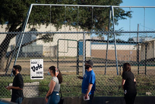 Voters wait in line outside Cody Public Library in San Antonio during the 2020 election. - TEXAS TRIBUNE / CLINT DATCHUK