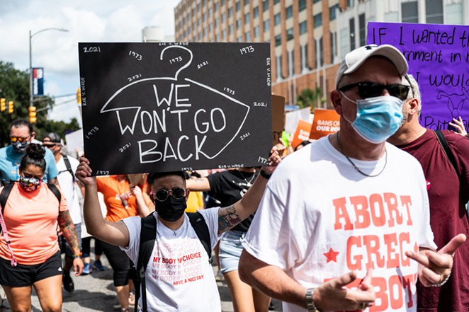 Protesters march through downtown San Antonio earlier this year to protest Texas' near-complete ban on abortions. - JAIME MONZON