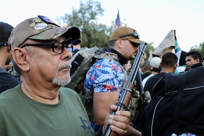 Armed right-wing activists engage in a standoff at the Alamo with Black Lives Matter protesters on May 30, 2020. - James Dobbins