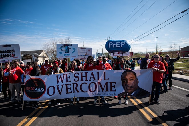 Marchers carry a banner during the 2020 Martin Luther King Day March in San Antonio. - JAIME MONZON