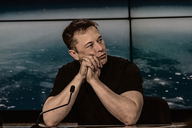 Elon Musk appears at a press conference following one of his company SpaceX's launches. - WIKIMEDIA COMMONS / DANIEL OBERHAUS