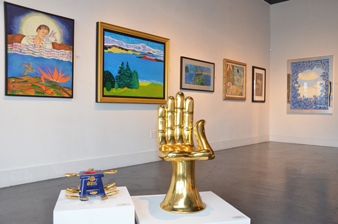 Pedro Friedeberg’s iconic Hand Chair welcomes visitors into “Neo-Surrealism & Magic Realism.” - BRYAN RINDFUSS