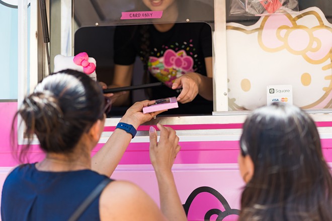 A customer transaction at the Hello Kitty Cafe Truck. - Courtesy of Hello Kitty Cafe Truck
