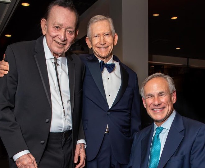 Although excluded from the 2022 Forbes Richest People list, H-E-B's Butt Family is estimated to be worth around $17 billion. Charles Butt (center) is posing with music icon Flaco Jimenez and Gov. Greg Abbott in this photo. - Photo via Facebook / H-E-B