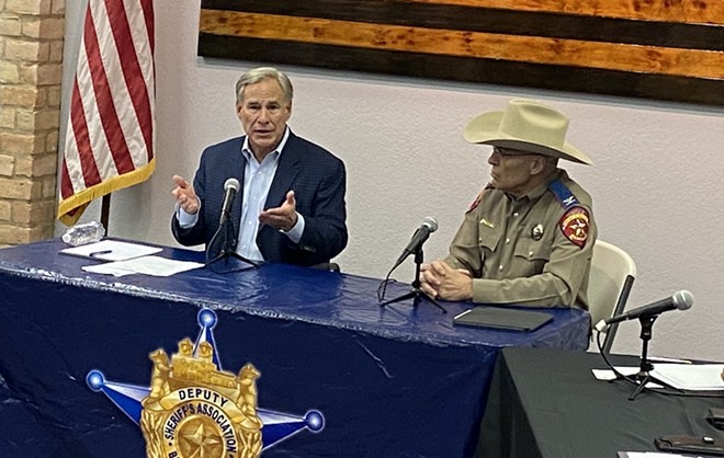 Gov. Greg Abbott talks up Operation Lone Star as Texas Department of Public Safety Director Steven C. McCraw looks on. Both were in San Antonio last week for a "law enforcement roundtable" organized by the governor's office. - Sanford Nowlin