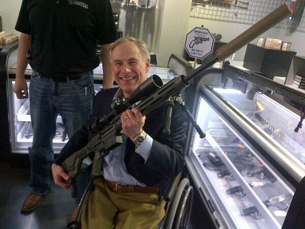 Gov. Get Abbott poses with a weapon during a gun-store photo op. - Twitter / @GregAbbott_TX