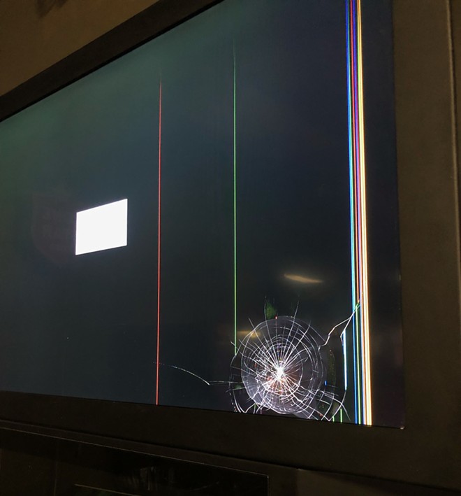 A broken jukebox screen that was hit by a stray bullet during the May shooting at Sir Winston's. - Nina Rangel
