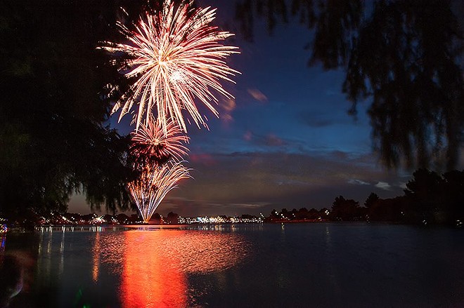 The free Independence Day celebration is capped off by fireworks above Woodlawn Lake. - Oscar Moreno