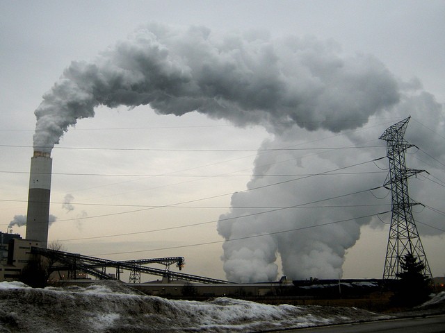 Emissions billow out of a smokestack. - Via Flickr user ribarnica