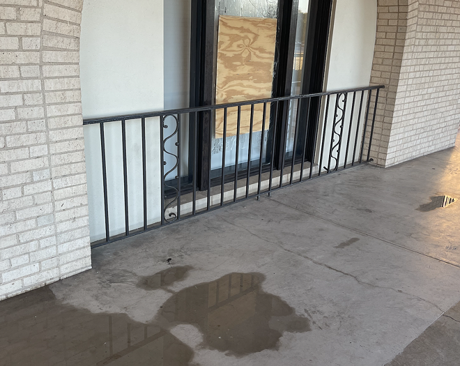 The blood of the man who broke a window attempting to save his child was hosed off and the window patched up as of Tuesday evening. Authorities told the Express-News the parent won't face charges. - Michael Karlis