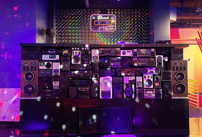 Local artist Colton Valentine helped create the façade of Be Kind & Rewind's DJ booth. - Nina Rangel