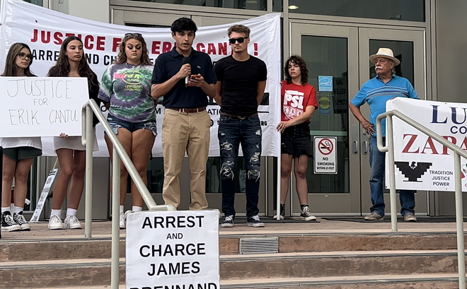 James Ramos, a friend of Erik Cantu, speaks to protesters earlier this month in front of the San Antonio Police Department's headquarters. - Michael Karlis