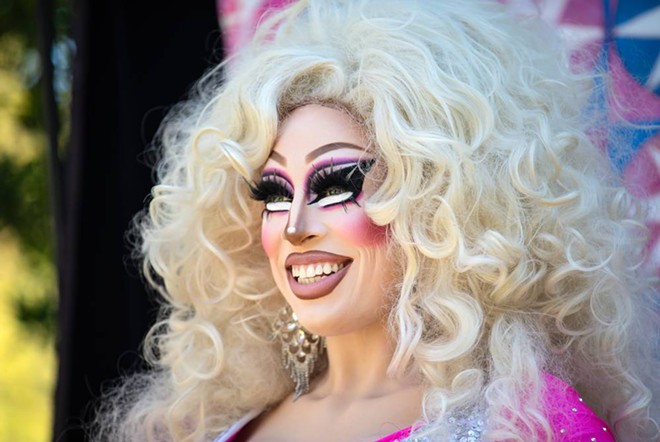 Brigitte Bandit, an Austin drag queen who has performed at family-friendly events, reads at a literacy event for children. “Like any form of art, drag can be modified to be appropriate for children,” Bandit said. - Texas Tribune / Montinique Monroe