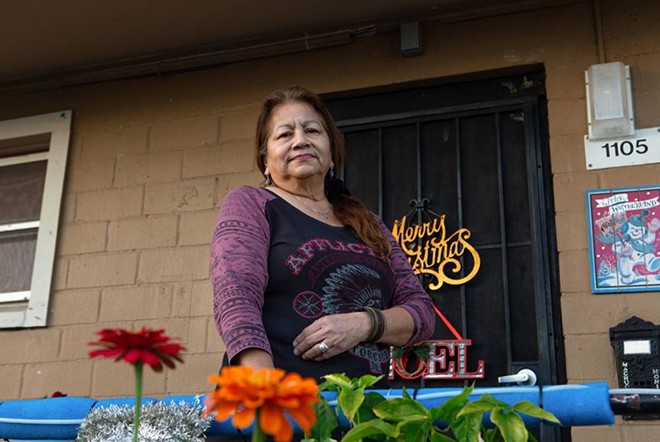 Monica R.M. has lived at Alazán-Apache Courts for five years, carefully tending her front-yard garden where she grows flowers and serrano peppers. Monica would like the apartments to stay as they are, only adding necessities such as a dryer connection. - Texas Tribune / Azul Sardo
