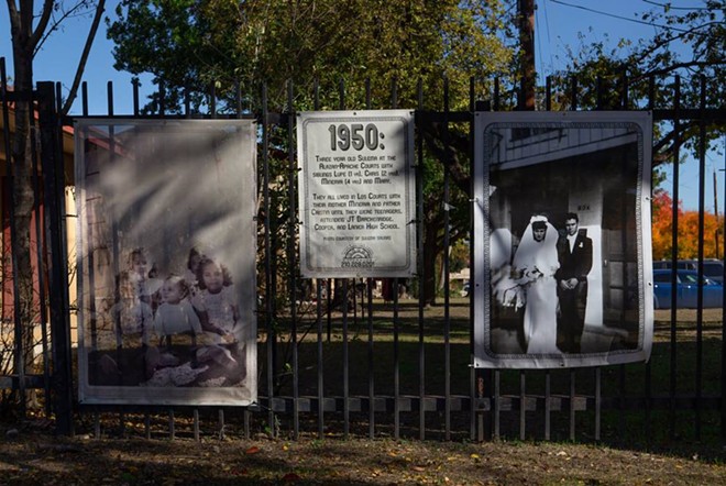 Large black-and-white photo banners line the neighborhood’s streets, depicting the area’s past. - Texas Tribune / Azul Sordo