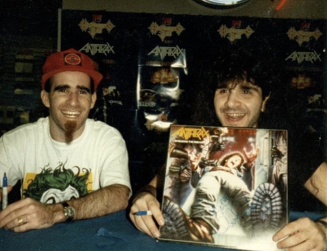 Anthrax members Scott Ian (left) and Charlie Benante sign LPs at Sound Warehouse on April 13, 1989. The band appeared at Freeman Coloseum that evening. - Mike McMahan