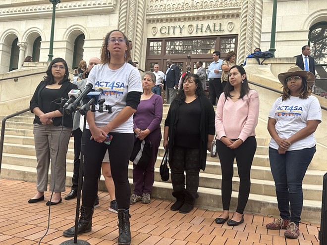 Ananda Tomas, executive director of police reform advocacy group Act 4 SA, accuses city attorney Andy Segovia of "undermining democracy" during a press conference at City Hall on Monday. - Michael Karlis