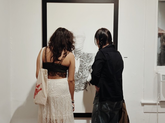Visitors to Sala Diaz look at work during the gallery's Kim Bishop exhibition. - Courtesy Photo / Sala Diaz