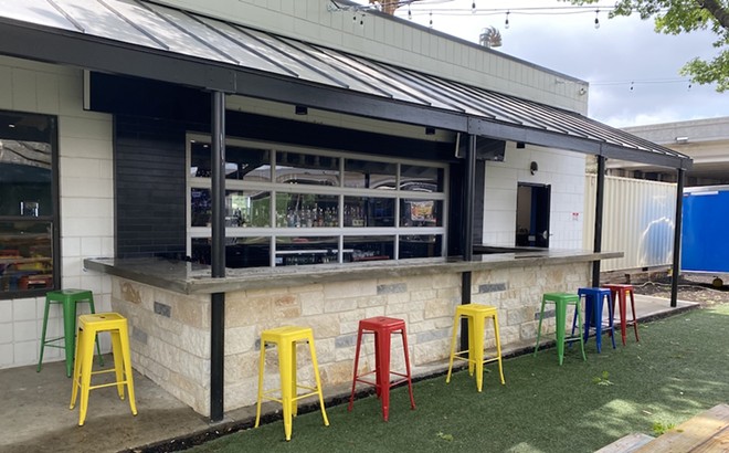 An outdoor bar opens up to the Astroturfed play area. - Sanford Nowlin