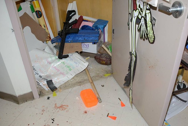 The gunman's AR-15 style rifle lays in a supply closet of Room 111 at Robb Elementary School.