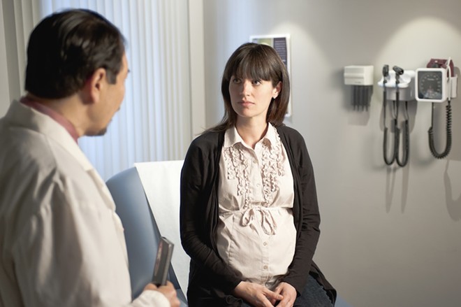 An obstetrician consulting a pregnant patient. - Unspash / U.S. Centers for Disease Control