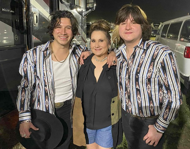 The Navaira brothers pose with their mother, Cynthia Navaira-Escobar, before their Poteet Strawberry Festival show. - Mike McMahan