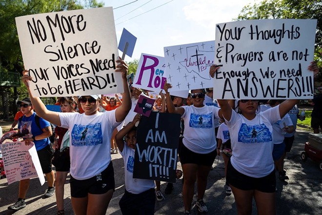 Family members and friends participate in a march on July 10, 2022, in support of those killed and injured in the school shooting at Robb Elementary in Uvalde. - Texas Tribune / Evan L'Roy