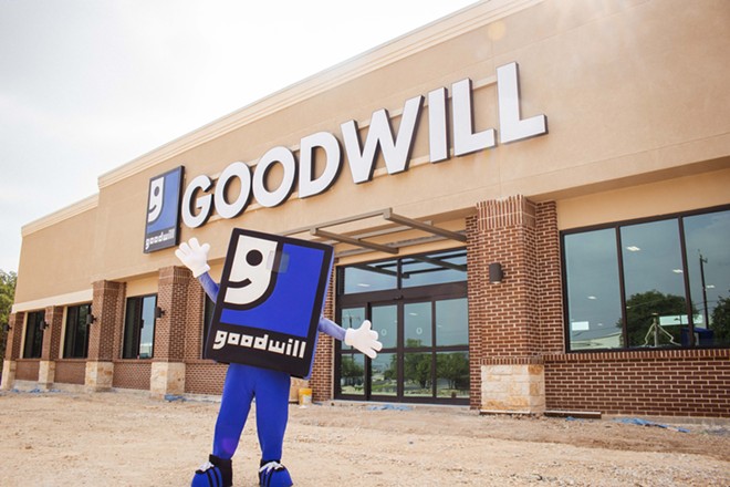 The Goodwill mascot stands outside a newly constructed store. - Courtesy / jgsocial