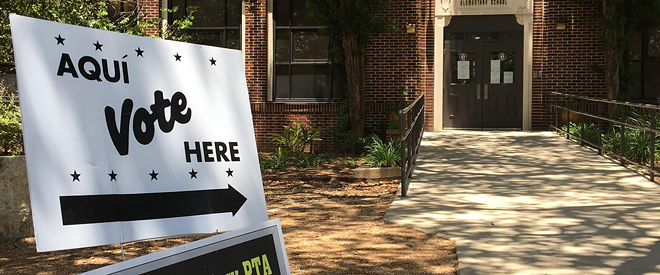 A sign points the way to a San Antonio polling place. - Sanford Nowlin