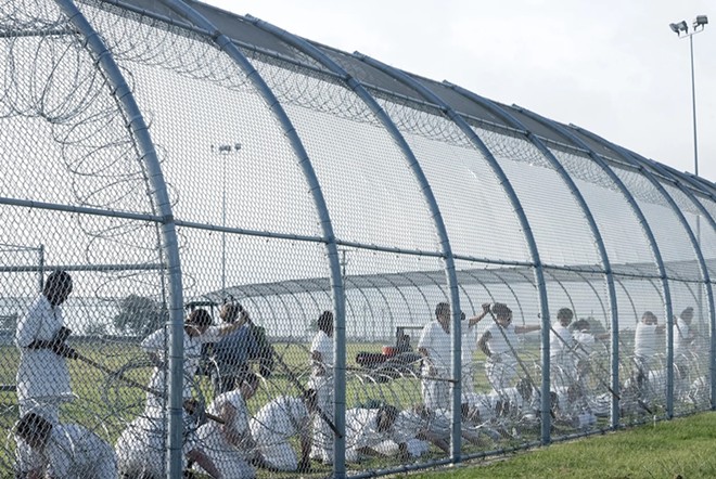 Trustees do work at a Texas women's prison. - Texas Tribune / Bob Daemmrich