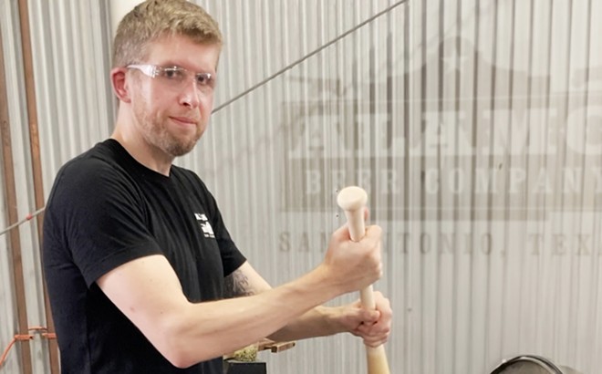 New VP of Operations Jan Matysiak stirs a brew with a maple bat at Alamo Beer Co. - Courtesy Photo / Alamo Beer Co.