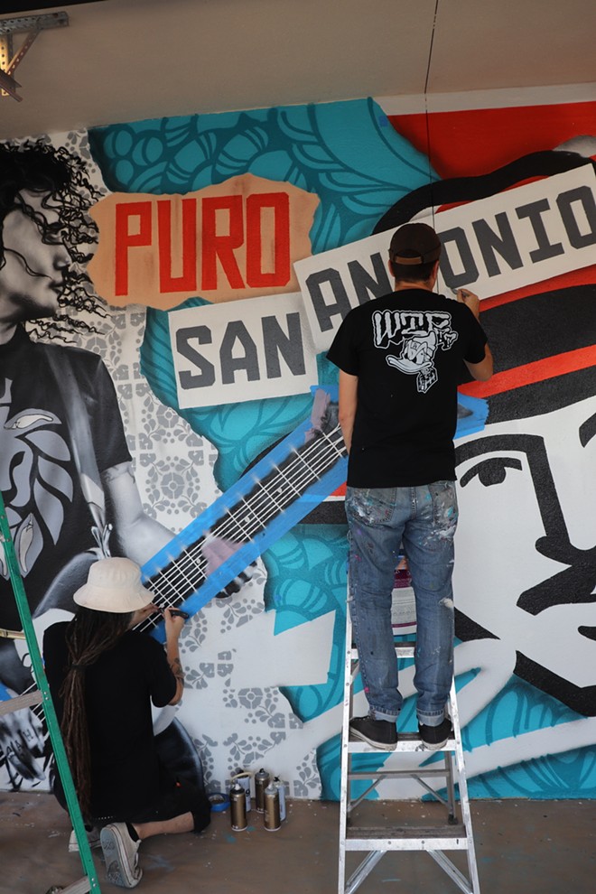 Los Otros work on the new mural inside Pizza Patrón’s Medical Center location. - Courtesy Photo / Pizza Patrón
