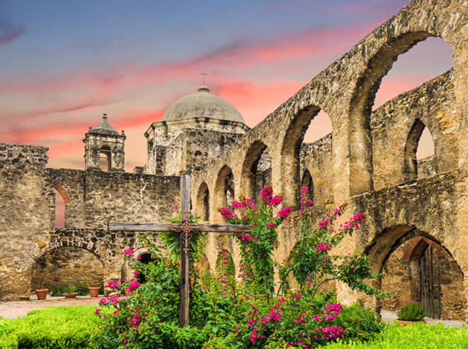San Antonio Mission San Jose sits under a colorful sunset. - Shutterstock / Sean Pavone