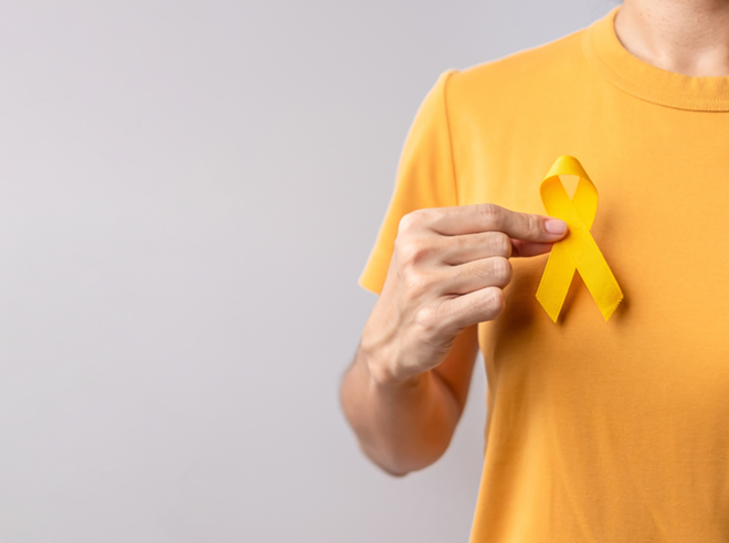 A yellow ribbon is the symbol for Suicide Prevention Month, which occurs in September. - Shutterstock / Jo Panuwat D
