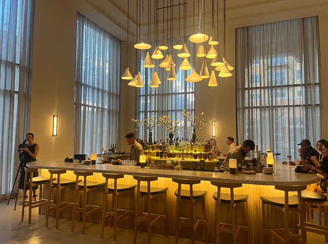 Ceramic pendants hang from the restaurant's 25-foot ceilings. Below them, a bar serves sake, wine, beer and Japanese inspired cocktails. - Brandon Rodriguez