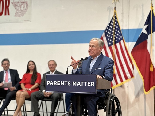 Gov. Greg Abbott shows he's serious during San Antonio appearance earlier this year to push his voucher plan. - Michael Karlis