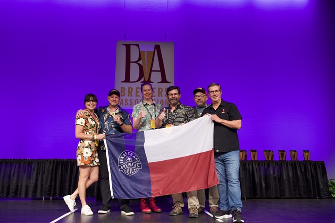 The Longtab Brewing Co. crew shows off its excitement after winning gold in the American-Belgo-Style Ale category. - Photo © Brewers Association