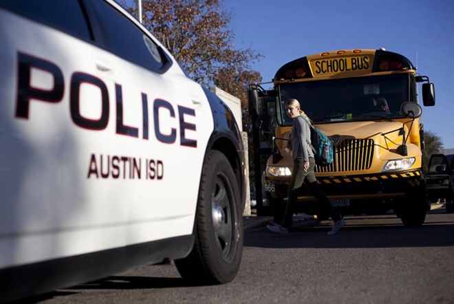 An Austin Independent School District police vehicle parked outside of McCallum High School in Austin, on Dec. 28, 2012. - Texas Tribune / Tamir Kalifa
