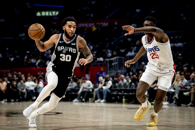 Spurs forward Julian Champagnie faces off against the Clippers' Moussa Diabate earlier this season. - Reginald Thomas II / San Antonio Spurs