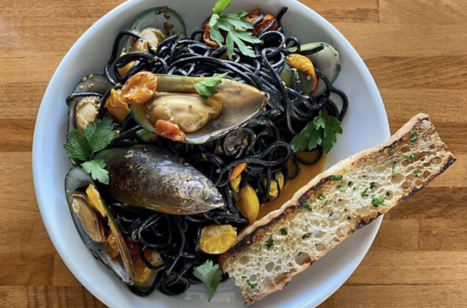 Tre Trattoria is known for Italian specialties like its squid ink pasta with mussels. - Instagram / tre_trattoria