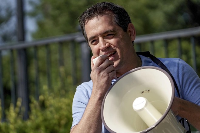 Former state representative Matt Rinaldi spoke to demonstrators at the Governor’s Mansion in protest of Gov. Abbott’s executive orders to close businesses and mandate masks during the COVID-19 pandemic. - Texas Tribune / Jordan Vonderhaar