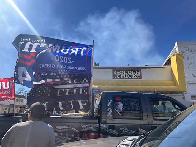 A truck outfitted with Trump flags moves through Eagle Pass during the weekend of the "Take Back Our Border" rally. - Bill Baird