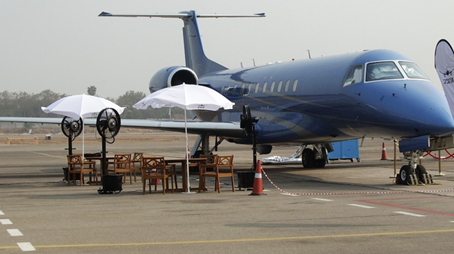 A Pilatus Pc-24 jet sits on display at an air show. - Shutterstock / Wirestock Creators