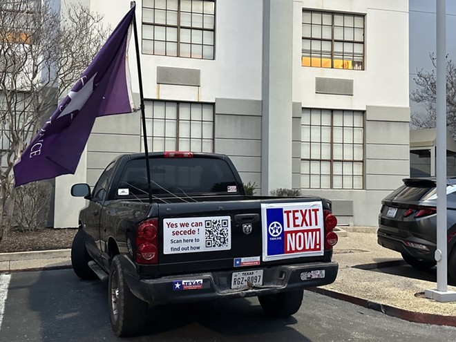 A pickup emblazoned with pro-TEXIT insignia is parked outside a Garden Inn in San Antonio ahead of a TNM meeting. - Michael Karlis