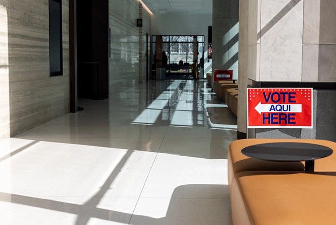 A 'vote here' sign is located inside of the Travis County Civil and Family Courts Facility on Mar. 1, 2024. - Texas Tribune / Maria Crane