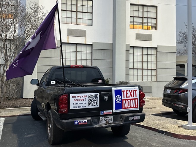 A pickup emblazoned with pro-TEXIT insignia is parked outside a Garden Inn in San Antonio ahead of a TNM meeting last month. - Michael Karlis